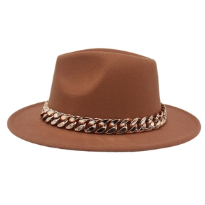Detail shot of a brown wool fedora hat featuring a chunky gold acrylic link chain decoration