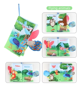 Detail view of baby soft cloth book featuring colorful flying animals and 3D textured tails