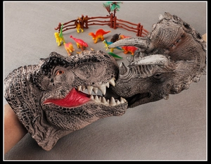 Detailed realistic dinosaur hand puppets showing T-Rex and Triceratops skin texture