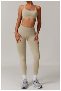 Detail of light olive seamless ribbed fabric on yoga sports bra and high-waist leggings