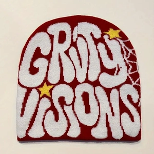Red knit beanie with white GRVTY VISONS jacquard text and yellow stars for winter style