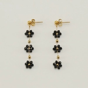 Elegant gold flower drop earrings featuring black crystal beads in bohemian floral design