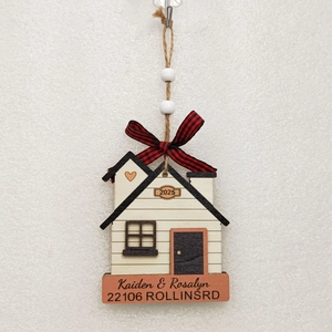 Detailed view of 2025 Christmas wooden house ornament with buffalo plaid bow and custom names