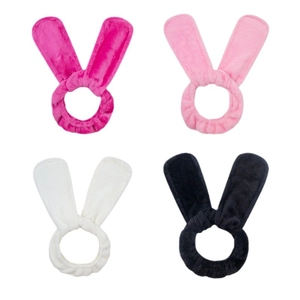 Set of four plush bunny ear hair bands in pink, beige, and black for heatless waves
