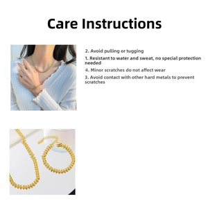 Detail of gold titanium heart necklace set showing lobster clasp and waterproof texture