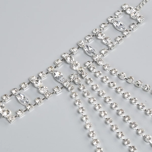 Close-up of silver-tone tassel body chain featuring sparkling rhinestones and layered fringe