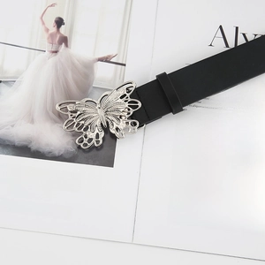 Detailed view of black leather belt with a large silver hollow butterfly metal buckle