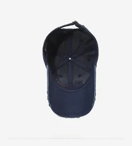 Detail of vintage navy blue washed baseball cap with Orlando embroidery and metal buckle