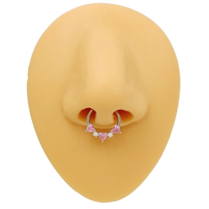 Detail view of heart-shaped nose ring with pink and white zircon on a nose model