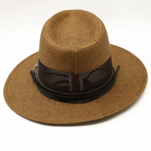 Detail of breathable mesh weave and leather band on men's vintage brown straw sun hat