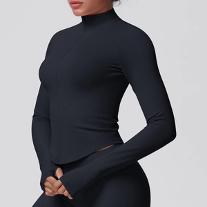 Close-up of black seamless fitness jacket with high-neck zipper and thumbhole cuffs