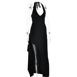 Detail of a black halter neck maxi dress with deep V-neck and high side slit on mannequin