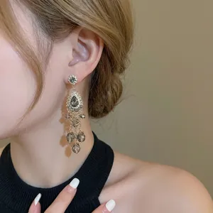 Bohemian silver needle drop earrings with sparkling rhinestones and crystal tassels