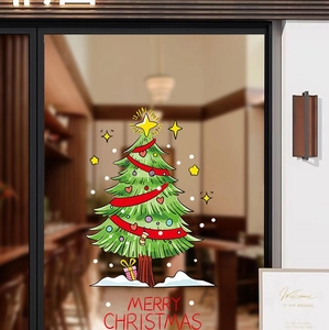 Détail de l'autocollant sapin de Noël avec texte Merry Christmas sur une vitre