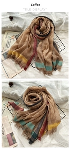 Detail of coffee brown striped wool scarf with fringe edges and vintage aesthetic