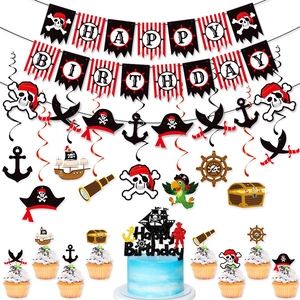 Close-up of pirate birthday party set including banners, swirls and cake toppers