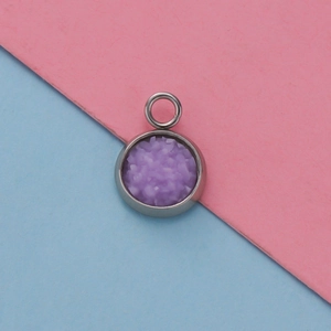 Detailed view of a 12mm purple star pattern pendant tray on a dual-color background