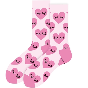Close-up detail of pink mid-calf socks with heart and eyelash patterns for daily wear