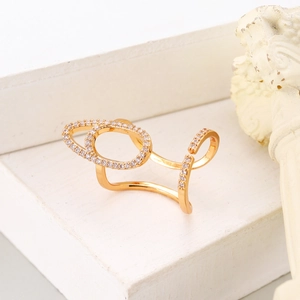 Detail of gold open nail ring with paved cubic zirconia on double oval design