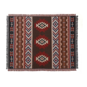 Bohemian geometric woven camping blanket with intricate fringe edges on white background