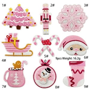 Detailed embroidery of 9-piece pink Christmas patch set including Santa and Snowman