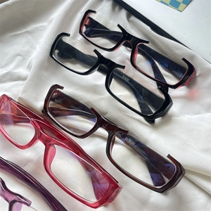 Close-up of rectangular eyewear frames in four colors with blue light blocking coating