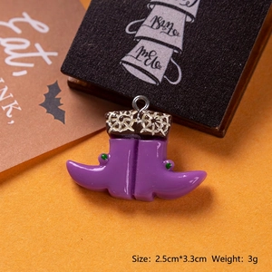 Detail view of purple resin witch boot charm with spider web texture for Halloween DIY
