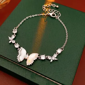 Exquisite resin butterfly bracelet with zircon accents on a green jewelry box