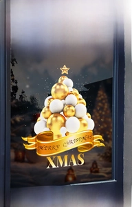 Close-up of golden Christmas tree window sticker with Merry Christmas ribbon on glass