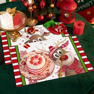Detail of Christmas placemats featuring a cute reindeer motif with festive striped borders