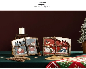 Detail of Santa and Snowman wooden frames with light and rustic branch decor