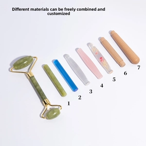 Detail view of jade roller with interchangeable handles in resin, wood and glass