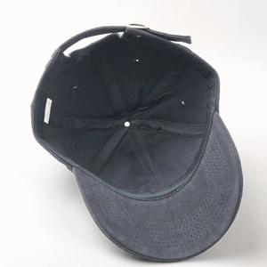 Internal view of cotton baseball cap showing 100% cotton label and adjustable strap
