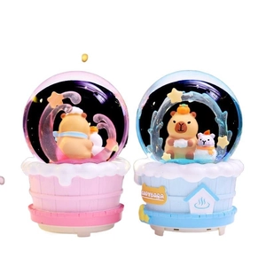Cute Capybara glowing crystal ball ornaments in pink and blue for desktop decor