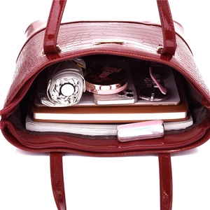 Three-piece crocodile pattern handbag set in burgundy with large interior storage space