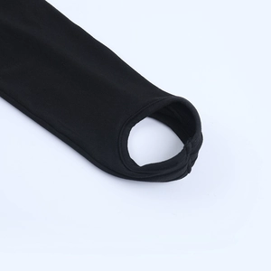 Detail of black knit bodysuit featuring a stirrup hem design and fine fabric texture