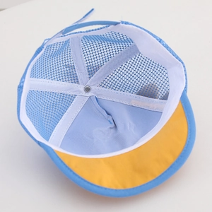 Detail view of baby mesh cap interior featuring blue mesh and yellow brim contrast
