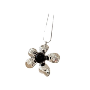 Metallic resin flower pendant necklace with black center stone on a silver chain