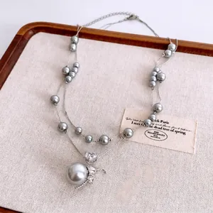 Collier double rang de perles grises avec pendentif éléphant et zircon en cœur