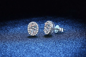 Macro detail of oval cut moissanite stud earrings in s925 sterling silver with halo setting
