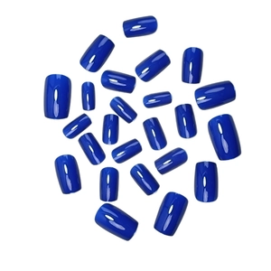 Glossy Klein blue press-on nails set in various sizes over a clean white background