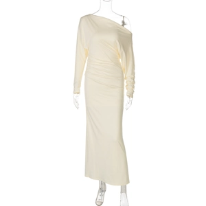 Detail view of the side-ruched tailoring and off-shoulder sleeve on the cream maxi dress