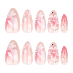 Pink and white gradient almond press-on nails with 3D floral accents and pearls