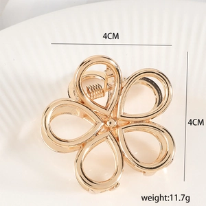 Elegant gold plum blossom metal hair claw clip with cutout design for women, 4cm size