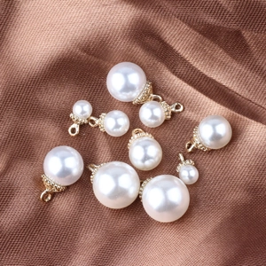 DIY pearl pendants with gold floral caps on brown silk for jewelry making
