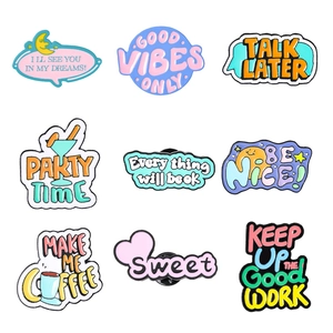 Set of 9 colorful creative enamel pins with motivational quotes on white background