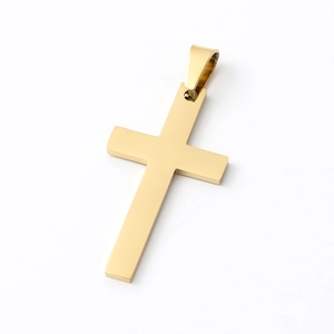Close-up of golden stainless steel cross pendant with a polished mirror finish detail