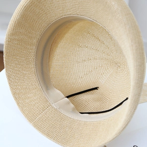 Elegant beige straw sun hat for women featuring interior sweatband and adjustable drawstring