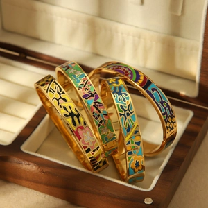 Chic 18k gold-plated floral enamel bangles with vibrant abstract patterns in a luxury box