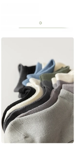 Close-up of multicolored combed cotton socks with ribbed cuffs in various soft neutral tones